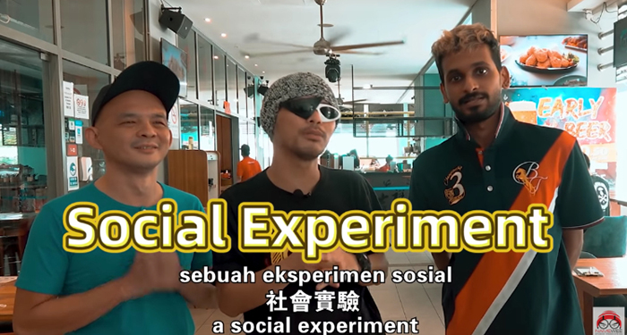 知名馬來西亞歌手黃明志，除了創作歌曲外，也常常拍攝一些大膽的社會實驗題材，藉此批評社會風氣。前日他在個人YT上傳了一支《種族歧視街頭實驗-借手機》的影片，探討馬來西亞對於「印度人」的種族歧視，由於加入了「搶手機」的片段，引發不小的爭議。